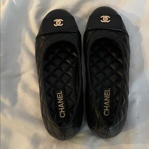 CHANEL Black Quilted Flats with Gold Logo